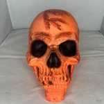 Halloween Scary Orange Skull Table Decoration Full Size Rugged Rubber. Fixed Price $15.00.