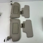 06-10 Infiniti M35X Dual Visors W/ Clips Lighted Mirrors Gray. Fixed Price $59.99.